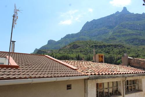 Monistrol de Montserrat Apartment | 3-Story Gaudi Building with Montserrat Stone