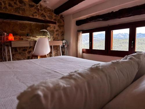 El Pinell de Brai House | Rural Stone House with wood fireplace