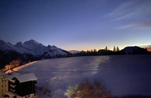 Manigod Apartment | South-facing mountain-view apartment with ski-in, ski-out convenience