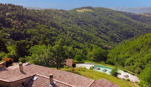 Enjoy a magnificent mountain panorama in this luxury vacation home with pool and sauna.