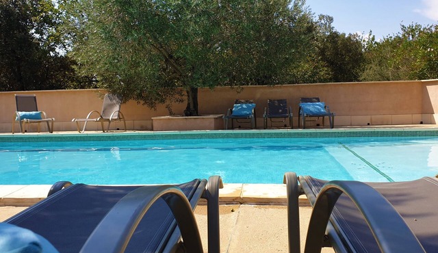 In Provence, lovely renovated farmhouse with swimming pool, wooded and flowered grounds