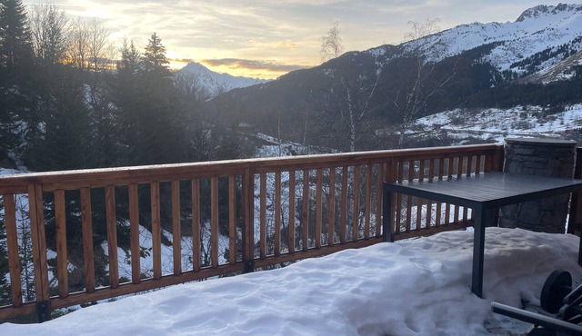 Mountain chalet at the foot of the ski slopes - resort center with parking lots