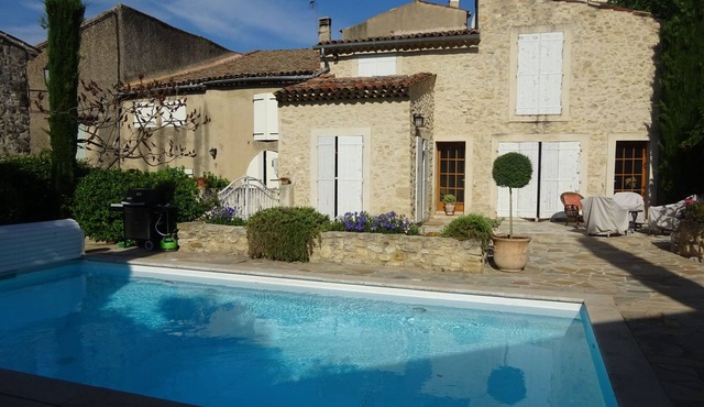 Renovated stone house with private walled garden, heated pool, in quiet village.
