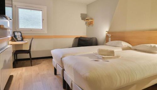 Triple Room with Two Single Beds and Sofa Bed